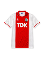 Ajax 1989-90 home jersey, front view, white body with central red stripe, red point collar with white and black trim, Umbro diamond logo, club crest, TDK sponsor logo, striped cuffs