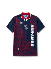 Ajax 1994-95 away jersey, front view, navy body with red baroque pattern, red point collar with white and blue stripes, Umbro diamond logo, club crest with Amsterdam text, vertical ABN AMRO sponsor lettering, commemorative Amsterdam tab