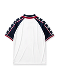 Manchester City 1997-98 away jersey, front view, navy upper body with white and maroon lower blocks, point collar with M.C.F.C. text, Kappa Omini sleeve pattern, club crest, Brother sponsor logo