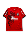 Corinthians 2011-12 third jersey, front view, red body with black São Jorge dragon graphic, black crew neck collar, Bozzano sleeve sponsor lettering, Nike swoosh, club crest with five stars, Neo Química Genéricos sponsor logo
