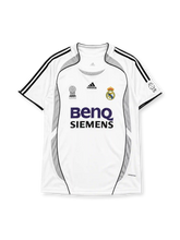 Real Madrid 2006-07 home jersey, front view, white body with grey Formotion panels, black adidas three-stripe shoulder detailing, FIFA Best Club of the Century emblem, LFP league patch, adidas logo, club crest, BenQ Siemens sponsor logo