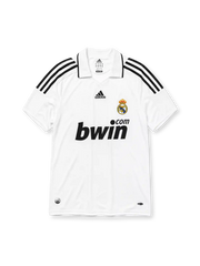 Real Madrid 2008-09 home jersey, front view, white body, black adidas three-stripe shoulder detailing, point collar, adidas logo, club crest, bwin.com sponsor logo, Climacool badge