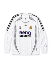 Real Madrid 2006-07 long sleeve home jersey, front view, white body with grey Formotion panels, black adidas three-stripe long sleeve detailing, FIFA Best Club of the Century emblem, adidas logo, club crest, BenQ Siemens sponsor logo