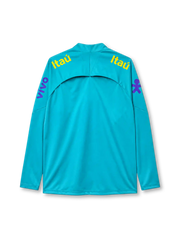 Brazil 2022-23 training top, front view, teal body with black geometric panels, quarter-zip funnel collar, Nike swoosh, CBF Brasil crest with five stars, Itaú sponsor text, Guaraná Antarctica sponsor logo, purple sleeve graphics