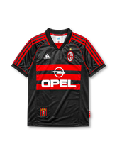 AC Milan 1998-99 third jersey, front view, black body with red hooped chest stripes, adidas three-stripe shoulder detailing, championship star, adidas logo, club crest, Opel sponsor logo