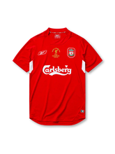Liverpool 2004-05 Champions League final home jersey, front view, red body with white underarm panels, funnel collar, Reebok logo, Istanbul 2005 commemorative text, club crest, Carlsberg sponsor logo