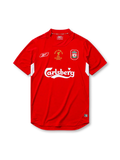 Liverpool 2004-05 Champions League final home jersey, front view, red body with white underarm panels, funnel collar, Reebok logo, Istanbul 2005 commemorative text, club crest, Carlsberg sponsor logo