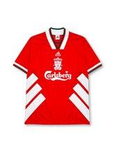 Liverpool 1993-95 home jersey, front view, red body with white diagonal chevron stripes, white V-neck collar with green and red trim, adidas Equipment wordmark, club crest, Carlsberg sponsor logo, striped cuffs