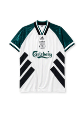 Liverpool 1993-95 away jersey, front view, white body with black diagonal chevron stripes, green tonal jacquard sleeves, V-neck collar, adidas Equipment wordmark, club crest, Carlsberg sponsor logo, striped cuffs