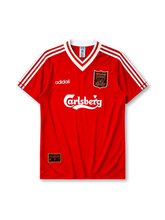 Liverpool 1995-96 home jersey, front view, red body, white adidas three-stripe shoulder detailing, white V-neck collar with red and gold trim, adidas logo, club crest, Carlsberg sponsor logo