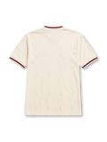 Liverpool 1996-97 away jersey, front view, ecru body with subtle jacquard pattern, red and black striped collar and cuffs, red Reebok logo, oval red and white Liverpool crest, black Carlsberg sponsor logo, woven tag near bottom hem