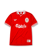 Liverpool 1996-97 home jersey, front view, red body, white polo-style collar with red and white stripe trim, white ribbed cuffs, white Reebok logo, oval red and white Liverpool crest, white Carlsberg sponsor logo, woven tag near bottom hem