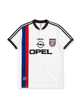 Bayern Munich 1996-98 away jersey, front view, white body with blue and red vertical stripe, black adidas three-stripe shoulder detailing, V-neck collar, adidas logo, club crest, Opel sponsor logo