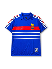 France 1984 home jersey, front view, royal blue body with tricolor striped shoulders, red horizontal chest band with white adidas trefoil logo, gold F.F.F. rooster crest with European Champions 1984 text, double white stripes, commemorative patch near hem