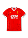 Liverpool 1981-84 home jersey, front view, red body with fine white vertical pinstripes, white V-neck collar with red piping, white cuffs, yellow Umbro logo, gold L.F.C. liver bird crest, white Crown Paints sponsor logo