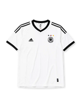 Germany 2002-03 home jersey, front view, white body with black V-neck collar, black adidas logo and stripes, three tricolor stars in black red and gold, DFB eagle crest, black cuffs