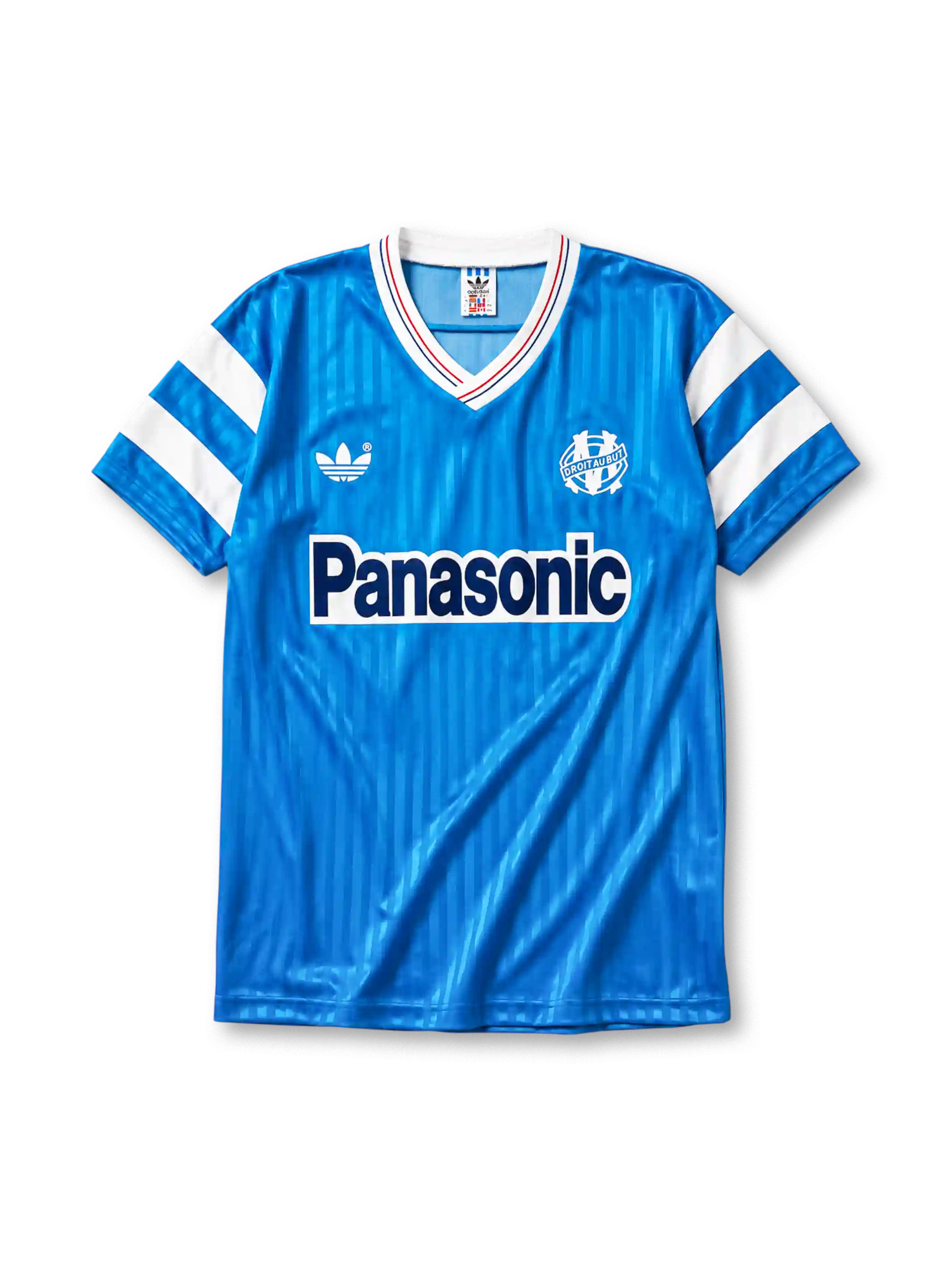 Marseille 1990 away jersey, front view, sky blue body with tonal pinstripe pattern, white V-neck collar with red and blue piping, white adidas trefoil logo, circular Olympique de Marseille crest, navy Panasonic sponsor logo