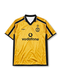 Manchester United 2001-02 away jersey, front view, gold body with black side panels, black V-neck collar with white piping, black Umbro logo, Manchester United devil crest and centenary 100 badge, black Vodafone sponsor logo