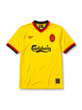 Liverpool 1998 away jersey, front view, bright yellow body, black and red V-neck collar, red Reebok logo, oval red Liverpool crest, black Carlsberg sponsor logo, black and red striped cuffs