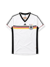 Germany 1998 home jersey, front view, white body with black red and gold horizontal chest band, black V-neck collar, black adidas logo, three tricolor stars, DFB eagle crest, black side panel stripes
