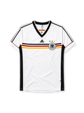 Germany 1998 home jersey, front view, white body with black red and gold horizontal chest band, black V-neck collar, black adidas logo, three tricolor stars, DFB eagle crest, black side panel stripes