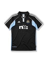 Newcastle United 2000-01 away jersey, front view, black body with sky blue side panels, black polo-style collar, white adidas logo and stripes, Newcastle United shield crest, white ntl sponsor logo, authentic product tag near hem