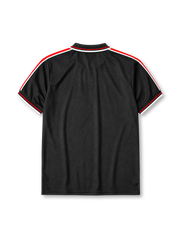 Manchester United 1998-99 third jersey, front view, black body, black white and red diamond pattern shoulder trim, black polo-style collar with zip placket, white Umbro logo, Manchester United devil crest, white Sharp sponsor logo