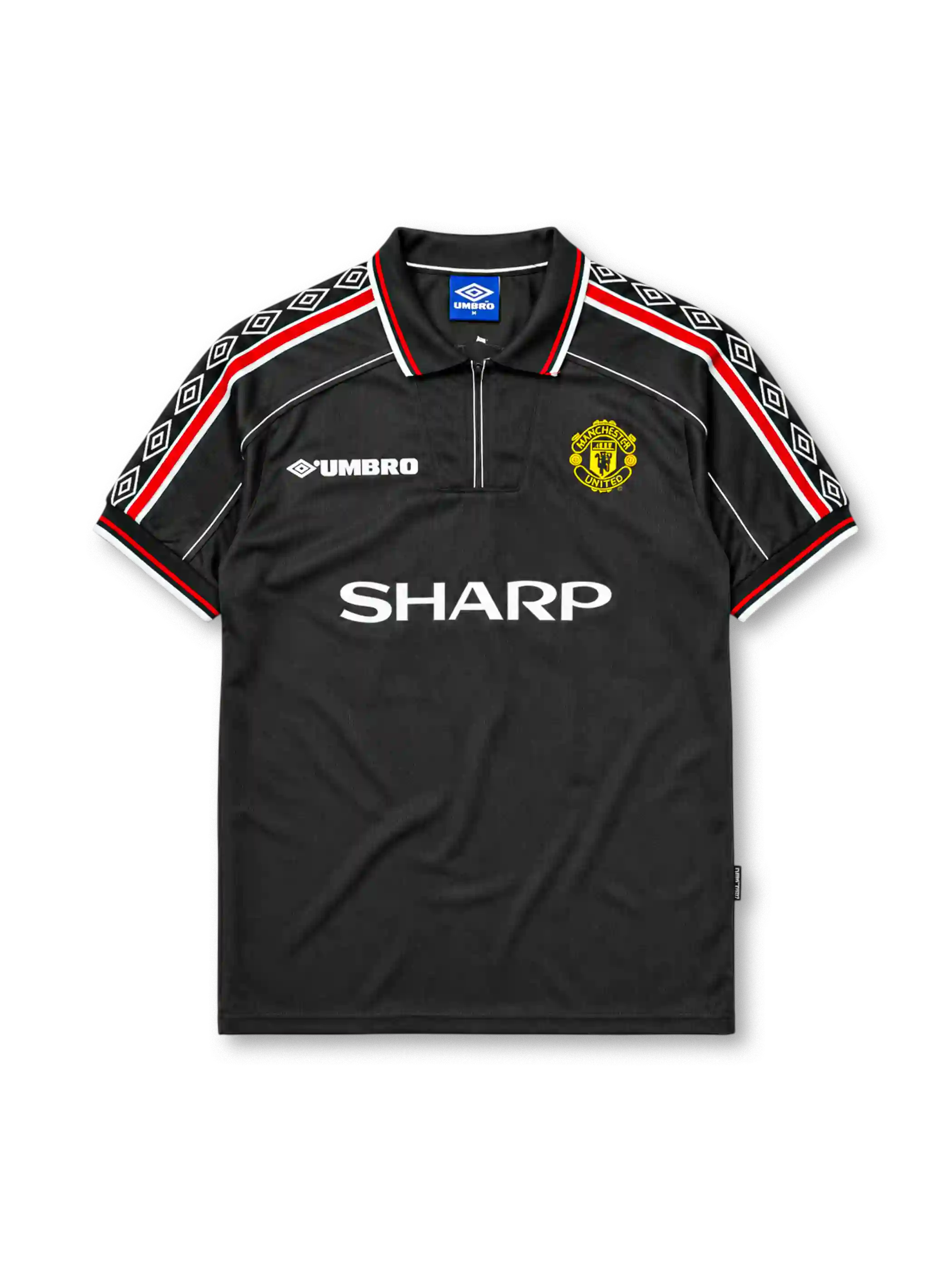 Manchester United 1998-99 third jersey, front view, black body, black white and red diamond pattern shoulder trim, black polo-style collar with zip placket, white Umbro logo, Manchester United devil crest, white Sharp sponsor logo