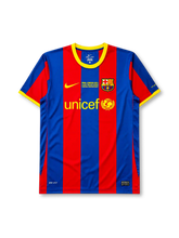 Barcelona 2010-11 Champions League final home jersey, front view, blue and red vertical stripes, yellow crew neck collar, Nike swoosh with Final London 2011 text, club crest, unicef sponsor logo