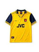 Arsenal 1996-97 away jersey, front view, yellow body with navy sleeves, point collar with Arsenal FC text, Nike swoosh logo, club crest, JVC sponsor logo