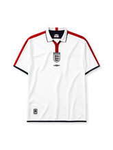 England 2004 home jersey, front view, white body with red shoulder stripes, white polo-style collar with red placket and navy trim, England text label, Three Lions crest, black Umbro diamond logo, navy trimmed cuffs