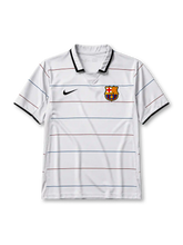 Barcelona 2003-04 away jersey, front view, white body with thin garnet and blue pinstripes, black polo-style collar and cuffs, black Nike swoosh, Barcelona crest