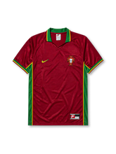 Portugal 1998 home jersey, front view, deep red body with green side panels, green V-neck collar with yellow piping, green Nike swoosh, Portuguese national crest, green and yellow trimmed cuffs
