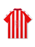 Atletico Madrid 1995-96 home jersey, front view, red and white vertical stripes with printed honors and championship years, red polo-style collar with navy chain pattern, navy Puma logo, Atletico Madrid shield crest, navy Marbella sponsor logo