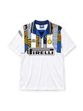 Inter Milan 1995-96 away jersey, front view, white body with abstract gold and black checkered panels and scratch pattern, blue and black striped polo collar, Umbro diamond logo, gold star above Inter crest, boxed black Pirelli sponsor logo