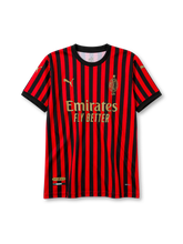 AC Milan 120th anniversary home jersey in red and black stripes with gold detailing and Emirates sponsor