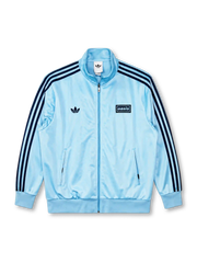adidas x Oasis Firebird track top sky blue front view with navy three stripes, trefoil logo, and oasis wordmark patch