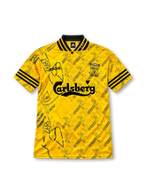 Liverpool 1994-96 third jersey, front view, yellow jacquard pattern with repeated crests, black and yellow striped collar, adidas three-stripe sleeve trim, Carlsberg sponsor logo, club crest