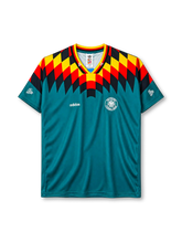 Germany 1994 World Cup away jersey, front view, teal body with black red and yellow diamond pattern, striped V-neck collar, adidas logo, DFB crest