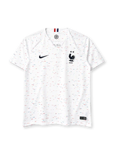 France 2018 World Cup Champions away jersey, front view, white body with red white and blue confetti print, navy collar, Nike swoosh, FFF crest with two stars