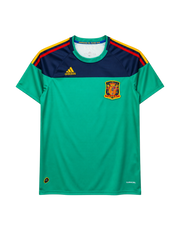 Spain 2010 World Cup goalkeeper jersey, front view, green body with navy yoke, red and yellow sleeve stripes, adidas logo, Spanish federation crest, Campeones del Mundo 2010 collar tape