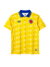 Colombia 1994 World Cup home jersey, front view, yellow body with football pattern, blue polo collar, Umbro logo, Colombian federation crest