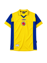 Colombia 2003-05 home jersey, front view, yellow body with blue side panels, yellow polo collar, Lotto logo, Colombian federation crest