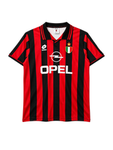 AC Milan 1996-97 home jersey, front view, red and black vertical stripes, striped polo collar, Lotto logo, Opel sponsor logo, Scudetto shield