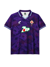 Fiorentina 1992-93 home jersey, front view, purple body with abstract crosshatch pattern, striped collar, Lotto logo, 7Up sponsor logo, diamond club crest