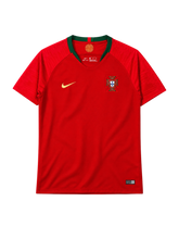 Portugal 2018 World Cup home jersey, front view, red body with green collar, textured shoulder pattern, Nike swoosh, Portuguese federation crest