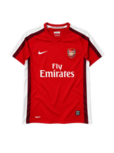 Arsenal 2008-09 home jersey, front view, red body with maroon and white sleeve stripes, Nike swoosh, Fly Emirates sponsor logo, club crest