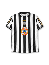 Newcastle United 1997-99 home jersey in black and white stripes with Newcastle Brown Ale sponsor