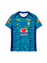 Brazil national team 2024 training top, front view, navy base with turquoise hand-drawn wave, floral and geometric graphic print, navy crew-neck collar, navy shoulder and side panels, yellow Nike swoosh, CBF crest with five stars and BRASIL text, two yellow Itaú logos on upper chest, Guaraná Antarctica logo on center chest, orange Vivo logos on both sleeves