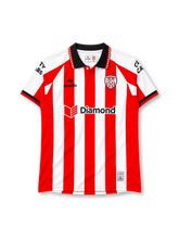 Derry City 2026 home jersey in red and white stripes with Diamond sponsor